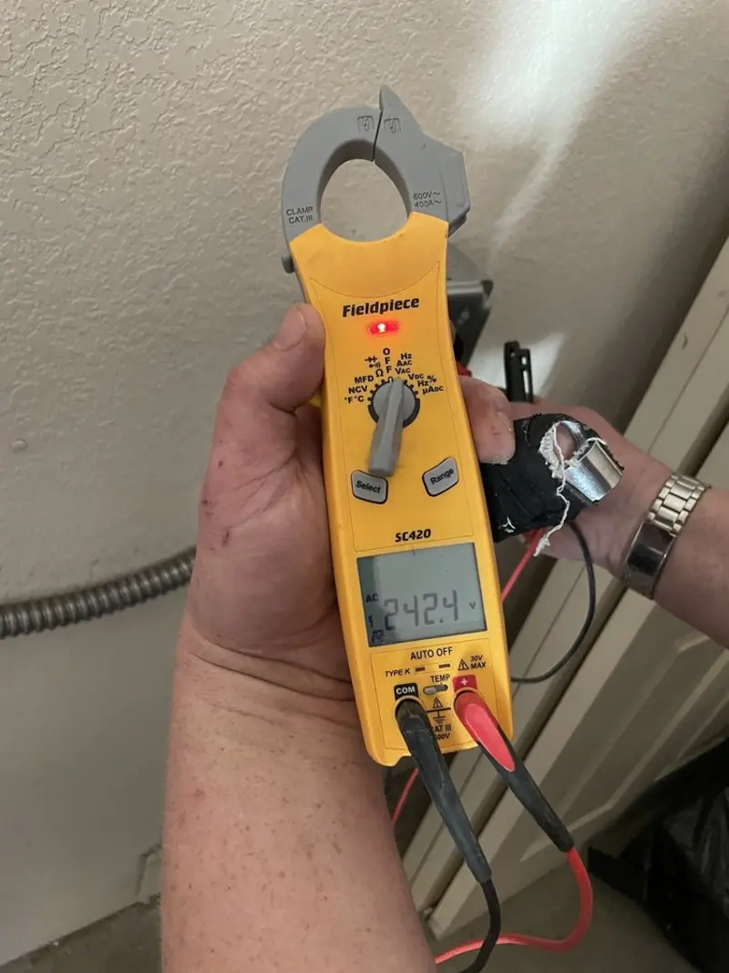 Voltage testing with clamp meter during Hot Tub / Pool Electrical Wiring in Piney